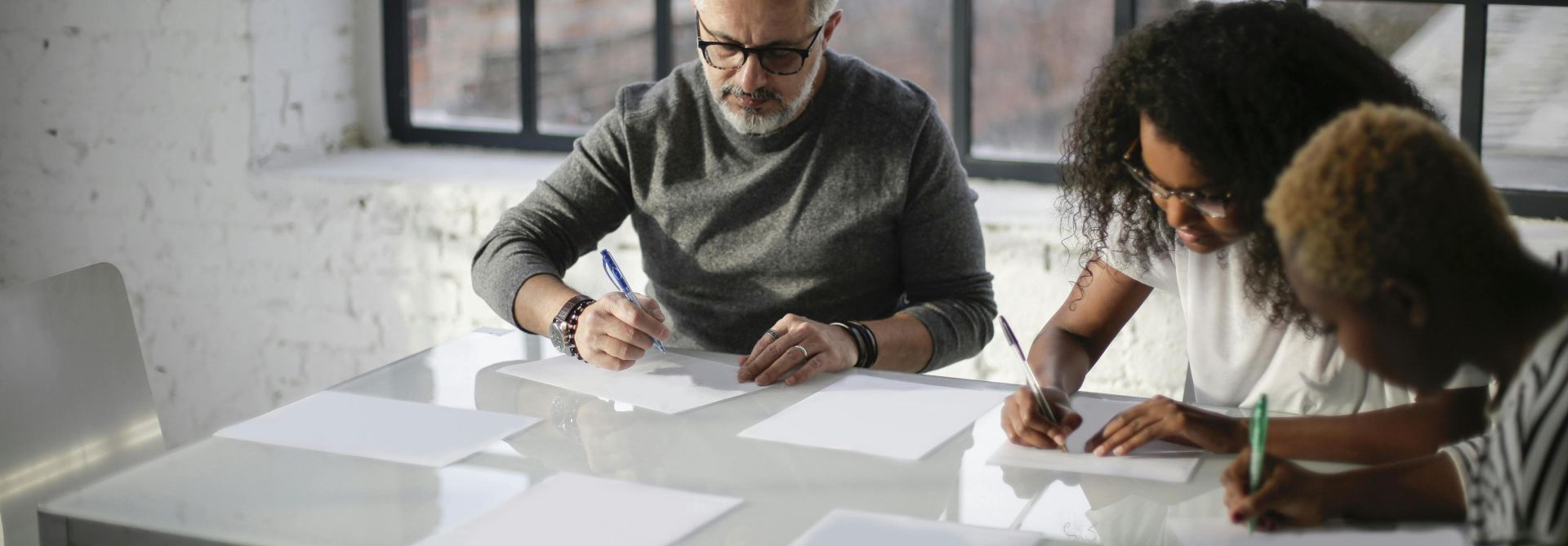 A diverse team collaborating in a modern office environment, focusing on project planning.